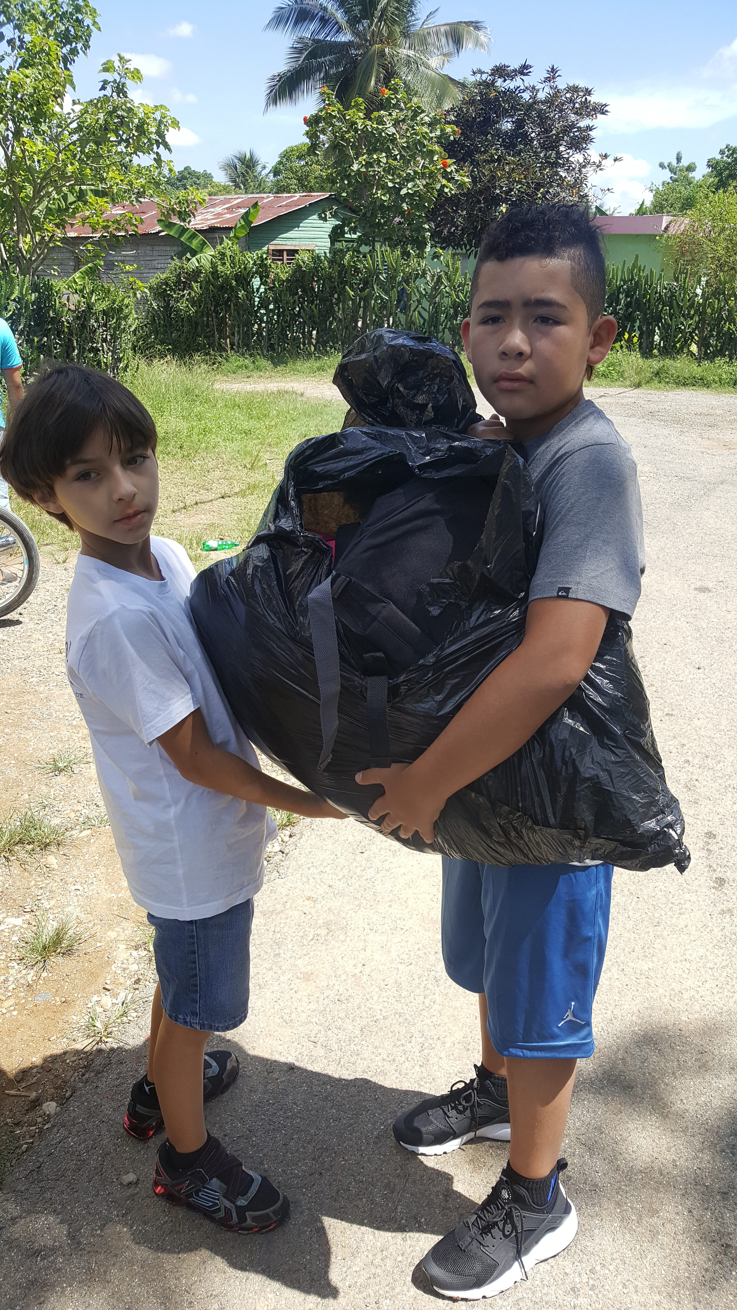 children holding bag