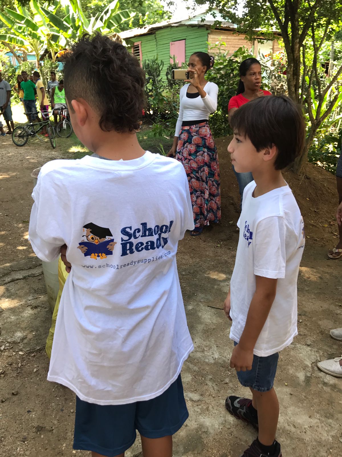 two children with school ready shirts