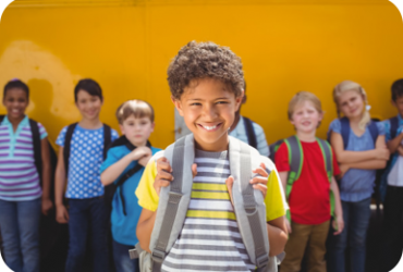 smiling child with backpack